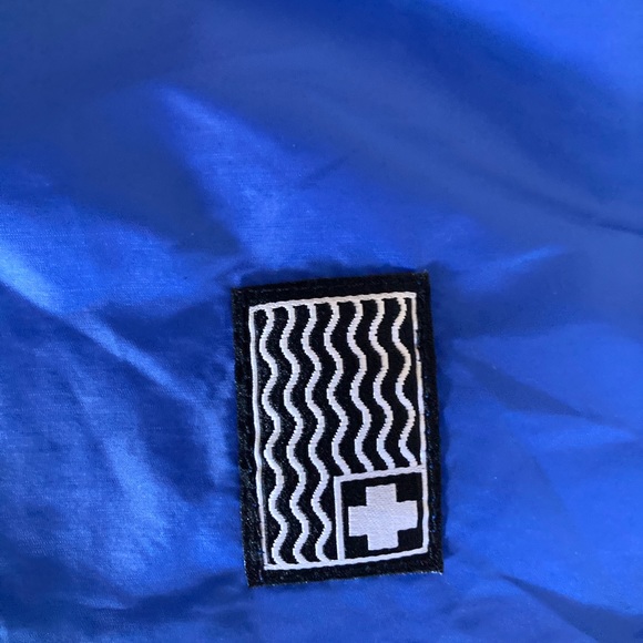 This is a tight fitting, gently used XL Pink+Dolphin Windbreaker. - Picture 3 of 5